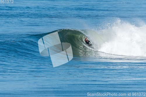 Image of Bodyboarder surfing ocean wave