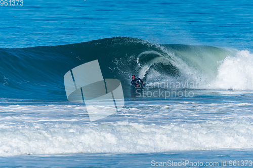 Image of Bodyboarder surfing ocean wave