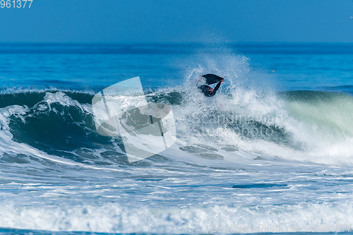 Image of Bodyboarder surfing ocean wave