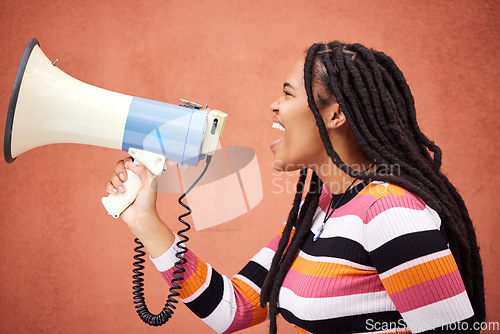 Image of Megaphone, protest or angry black woman with speech announcement for politics, equality or human rights. Young feminist leader, stop or loud gen z girl shouting for justice or help on wall background