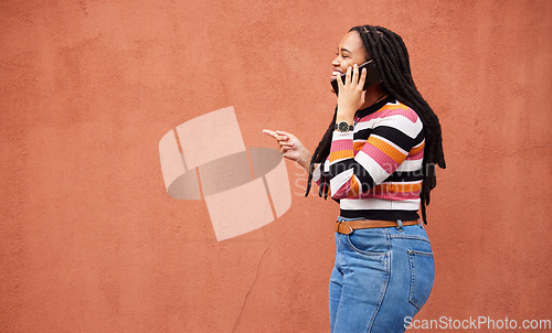 Image of Happy black woman, phone call and smile on wall background with happiness, conversation and mockup space. African female talking on mobile, color mock up and smartphone communication with technology