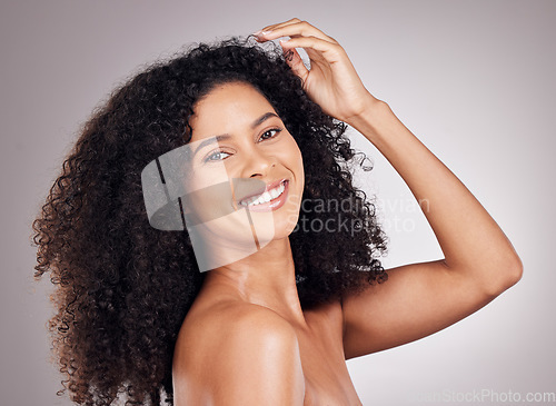 Image of Skincare, beauty and portrait of a woman in a studio with a natural, cosmetic and face routine. Health, wellness and female model from Puerto Rico with a facial treatment isolated by gray background.