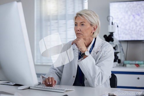 Image of Science, computer and female scientist working on research, experiment or test for a project in lab. Technology, professional and senior woman scientific expert doing an analysis on pc in laboratory.