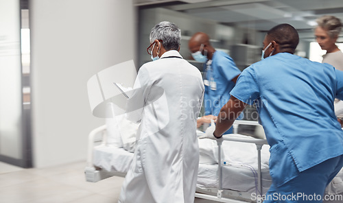 Image of Busy, healthcare and doctors rush with patient, surgery and ready for procedure in hospital. Fast team, medical professional and staff with emergency, accident and health with wellness and nurses