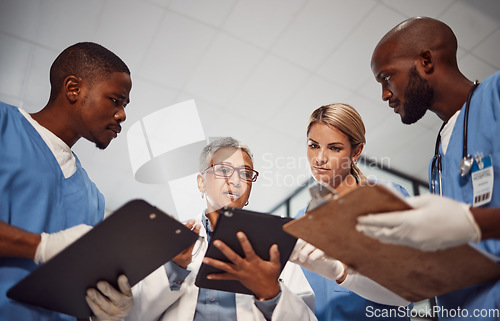 Image of Tablet, teamwork and group of doctors in hospital management, results and medical data with manager. Nurse, professional healthcare people and technology of clinic review, planning or problem solving