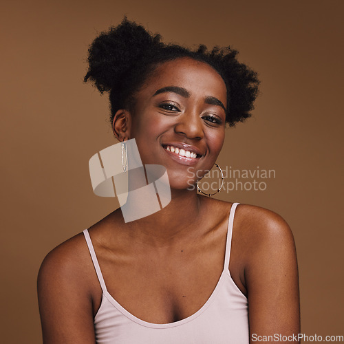 Image of Black woman, smile and student portrait of a gen z person with makeup and jewelry in a studio. Isolated, brown background and happiness of a young female with skincare glow, cosmetics and face