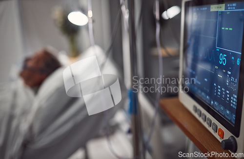 Image of Hospital electrocardiogram, critical care and icu patient with doctor tech in a clinic. Blurred background, heart rate monitor and healthcare technology screen with cardiology and blurred background