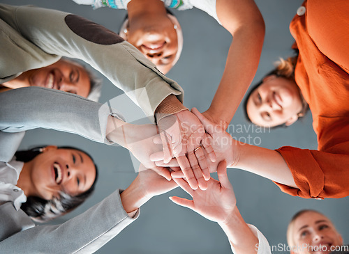 Image of Team building, hands together and diversity of women in office feeling community, support and success. Happiness, collaboration and teamwork of happy people below with work cooperation and motivation