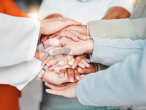 Image of Team, hands together and collaboration in trust or unity for coordination or corporate goals at the office. Hand of group in teamwork celebration for partnership, agreement or community support