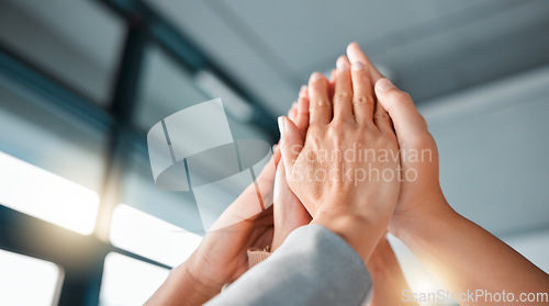 Image of Hands, team and high five for collaboration, trust or unity in coordination or corporate goals at the office. Hands of group in teamwork celebration for partnership, agreement or community support