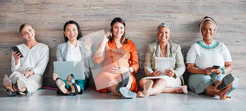 Image of Creative business people, portrait smile and networking sitting together on floor at office. Happy group of employee women smiling with technology in team hiring, welcome or management for startup