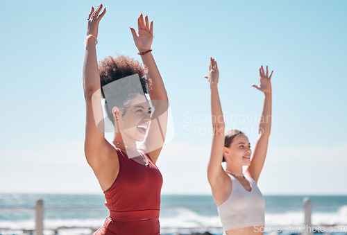 Image of Yoga, chakra and beach with woman friends outdoor together in nature for wellness training. Exercise, fitness or zen with a female yogi and friend outside for a mental health workout by the ocean