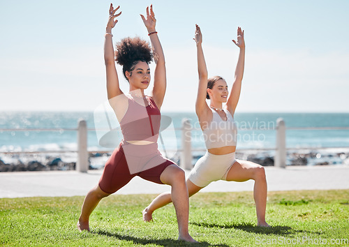 Image of Yoga, fitness and beach with woman friends outdoor together in nature for wellness training. Exercise, chakra or zen with a female yogi and friend outside for a mental health workout by the ocean