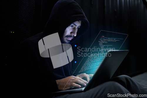 Image of Cyber security, crime and hacker with laptop coding malware in data center stealing sensitive digital information. Technology, software and man hacking in database to update ransomware on website.