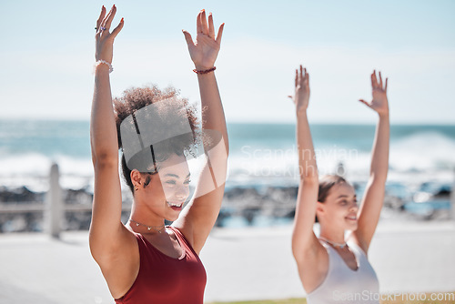 Image of Yoga, exercise and beach with woman friends outdoor together in nature for wellness training. Fitness, chakra or zen with a female yogi and friend outside for a mental health workout by the ocean