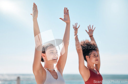 Image of Yoga, zen and beach with woman friends outdoor together in nature for wellness training. Exercise, chakra or fitness with a female yogi and friend outside for a mental health workout by the ocean