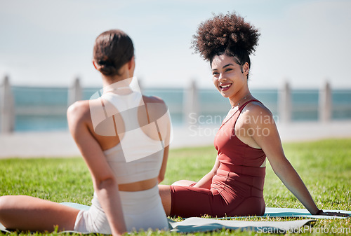 Image of Yoga, park and couple of friends or women talking of fitness, exercise and wellness class in diversity and support. Happy black woman or people with zen, health and holistic sports together in nature