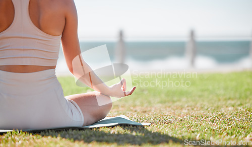 Image of Yoga, meditation and hands of woman on grass for healthy lifestyle, body wellness and cardio workout. Sports, pilates training and girl doing exercise for mindfulness, spiritual zen and peace in park