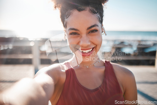 Image of Fitness, black woman and portrait smile for selfie, vlog or profile picture by beach for running exercise. Happy African American female runner smiling for social media, memory or post by ocean coast