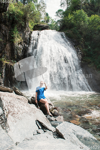 Image of Woman at Korbu Waterfall