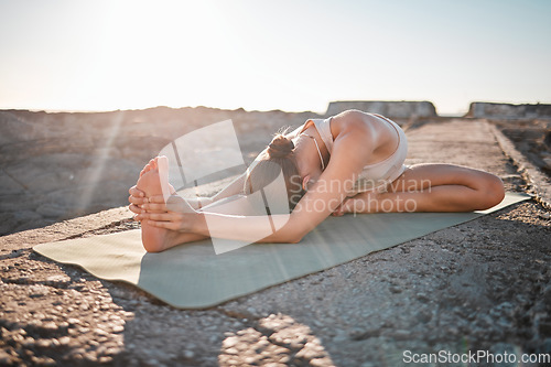 Image of Yoga, wellness and woman stretching body on rock for healthy lifestyle, pilates training and cardio workout. Sports, fitness and girl doing meditation, stretch and exercise for zen, peace and calm