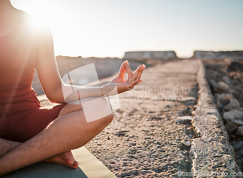 Image of Woman, hands and meditation in yoga on rock for spiritual wellness or peaceful exercise in nature. Hand of female yogi in calm meditating for zen workout, relax or awareness by ocean coast on mockup