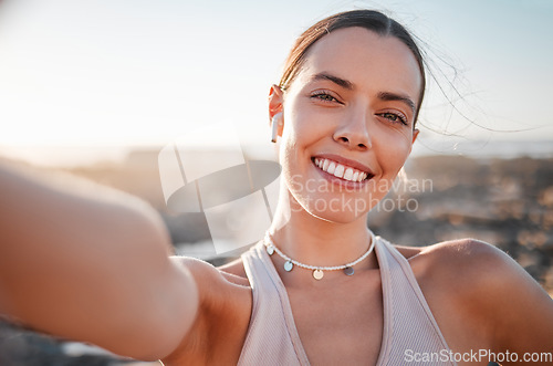 Image of Fitness, woman and portrait smile for profile picture, selfie or vlog by beach for healthy exercise. Happy female runner smiling with teeth for social media, memory or post by ocean coast outdoors