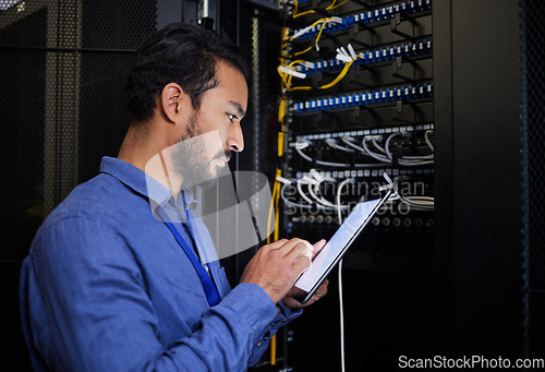 Image of Database tablet, server room and engineer man looking at research for maintenance or software update at night. Cybersecurity, it programmer or male coder with technology for networking in data center