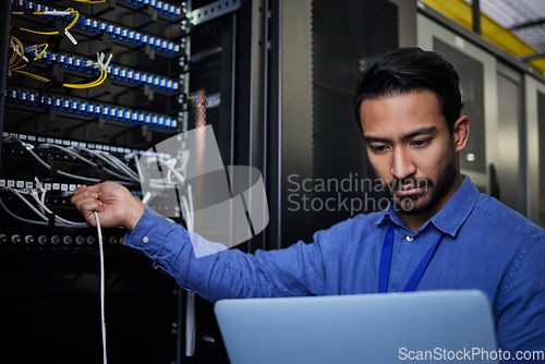 Image of Engineer laptop, server room and cable connection for software update or maintenance at night. Cybersecurity coder, cloud computing and programmer man with computer for networking in data center.