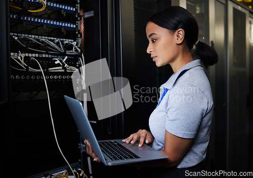 Image of Engineer, laptop database and woman in server room for software update or maintenance at night. Cybersecurity coder, cloud computing and female programmer with computer for networking in data center.