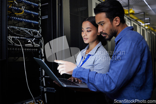 Image of People, maintenance or laptop in server room, IT engineering or software programming ideas in cybersecurity. Repair woman, man or data center technology in teamwork collaboration for safety analytics