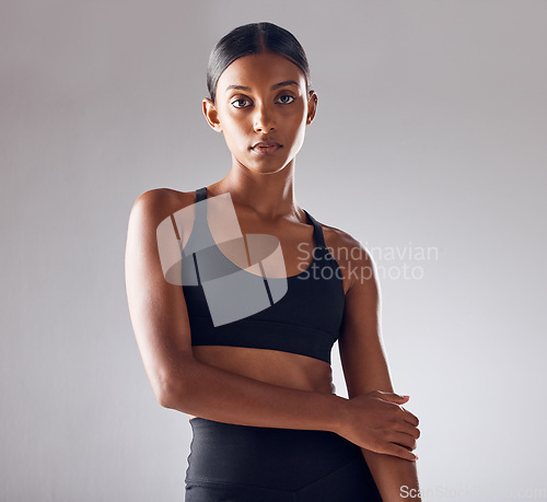 Image of Portrait, fitness and beauty woman isolated on studio background for health, wellness and training mockup. Confident indian person, athlete or model with sports fashion, workout and exercise for body