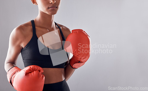 Image of Boxing, gloves and woman on background, mockup and space for sports exercise, strong warrior and mma training. Female boxer, workout and fist fight in studio, energy and power in challenge of mock up