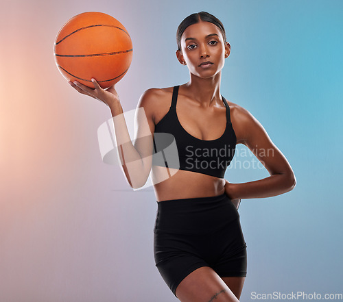 Image of Portrait, basketball and black woman isolated on gradient background for workout, training and body goals. Young Indian athlete, person or model in studio with ball focus. exercise or cardio health