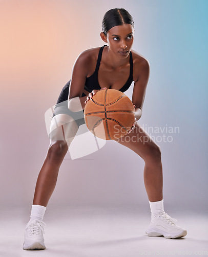 Image of Fitness, basketball player or black woman isolated on gradient background in action, challenge and body workout. Indian person or young model in studio training, exercise and ball with focus mindset