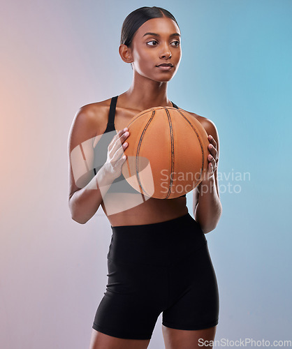 Image of Fitness, basketball and sports woman isolated on gradient background for workout, training and body exercise. Young Indian athlete, person or model in studio with ball in focus. game or cardio health