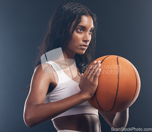 Image of Basketball player, sports training and studio woman for wellness challenge, practice game or fitness competition. Performance workout, health exercise and athlete model isolated on dark background