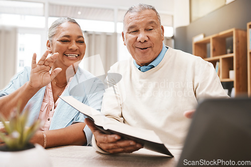 Image of Wave, laptop and senior couple on video call with book or bible for spiritual studying or reading in home. Greeting, retirement and elderly man and woman waving on online or web chat with computer.