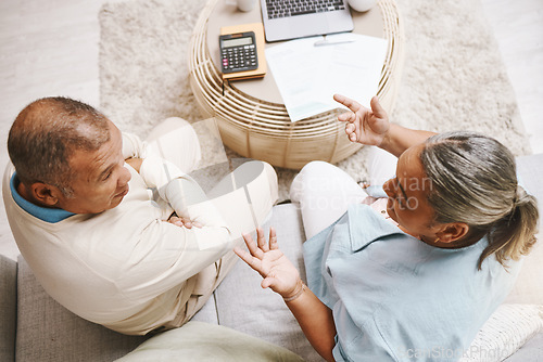 Image of Senior couple, documents and laptop for planning, budget or taxes with discussion for future in top view. Old man, woman and conversation for insurance, will or financial strategy for retirement life