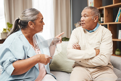 Image of Senior couple, fight and angry on sofa for marriage problems, conflict and communication. Divorce, argument and frustrated partner of man, woman and people in anger, living room and blame of affair