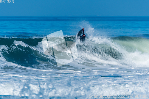 Image of Bodyboarder surfing ocean wave