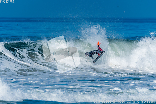 Image of Bodyboarder surfing ocean wave