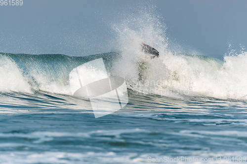 Image of Bodyboarder surfing ocean wave