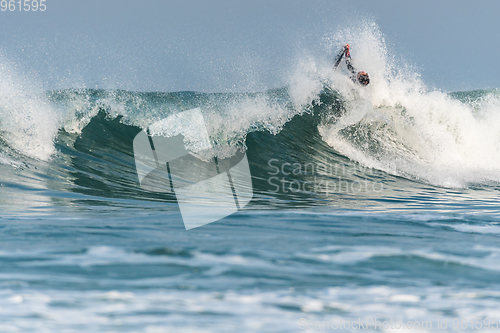 Image of Bodyboarder surfing ocean wave