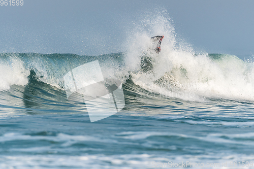 Image of Bodyboarder surfing ocean wave