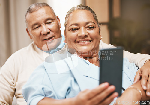 Image of Love, senior couple and selfie in home for happy memory while spending time together. Romance, retirement and smile of elderly and retired man and woman taking pictures or photo for social media.