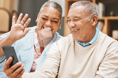 Image of Video call, wave or old couple talking, communication or speaking in conversation in retirement at home. Partnership, elderly man or happy senior woman greeting online on phone together with smile