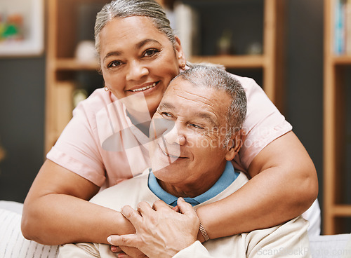 Image of Love, senior couple and hug in living room home, bonding caring and smiling. Valentines day, romance and portrait of man and woman hugging, embrace and cuddle for support while enjoying time together