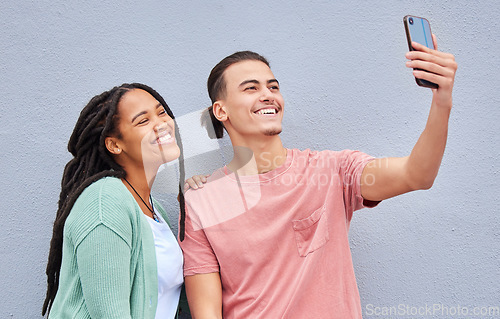 Image of Love, friends and selfie with smile, casual and wall with freedom, trendy and loving together. Black woman, man and smartphone for picture, share post and social media on studio background and happy