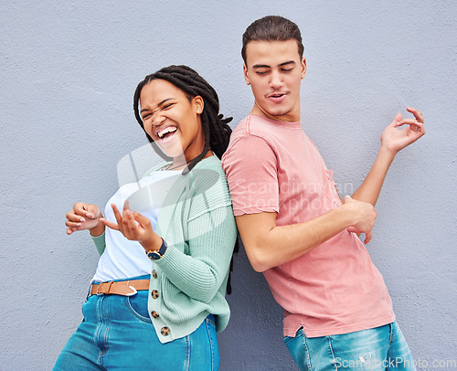 Image of Dance, happy and playful couple with air guitar for comedy isolated on a grey studio background. Excited, crazy and interracial man and woman playing and dancing with an imaginary instrument